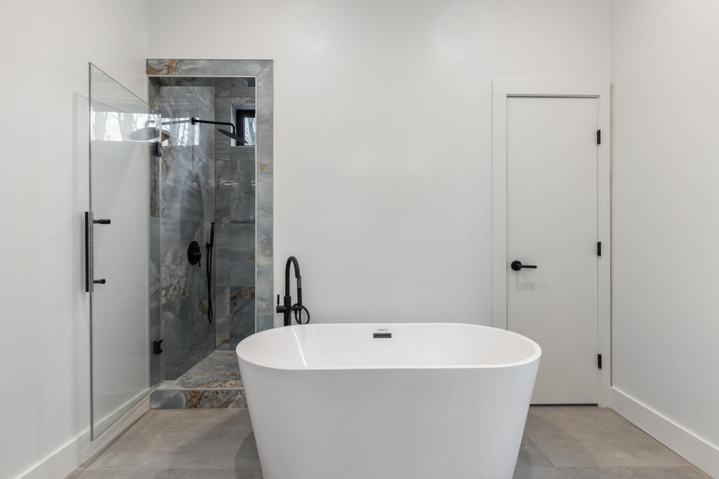 Bathtub and standing shower in Reynard custom home
