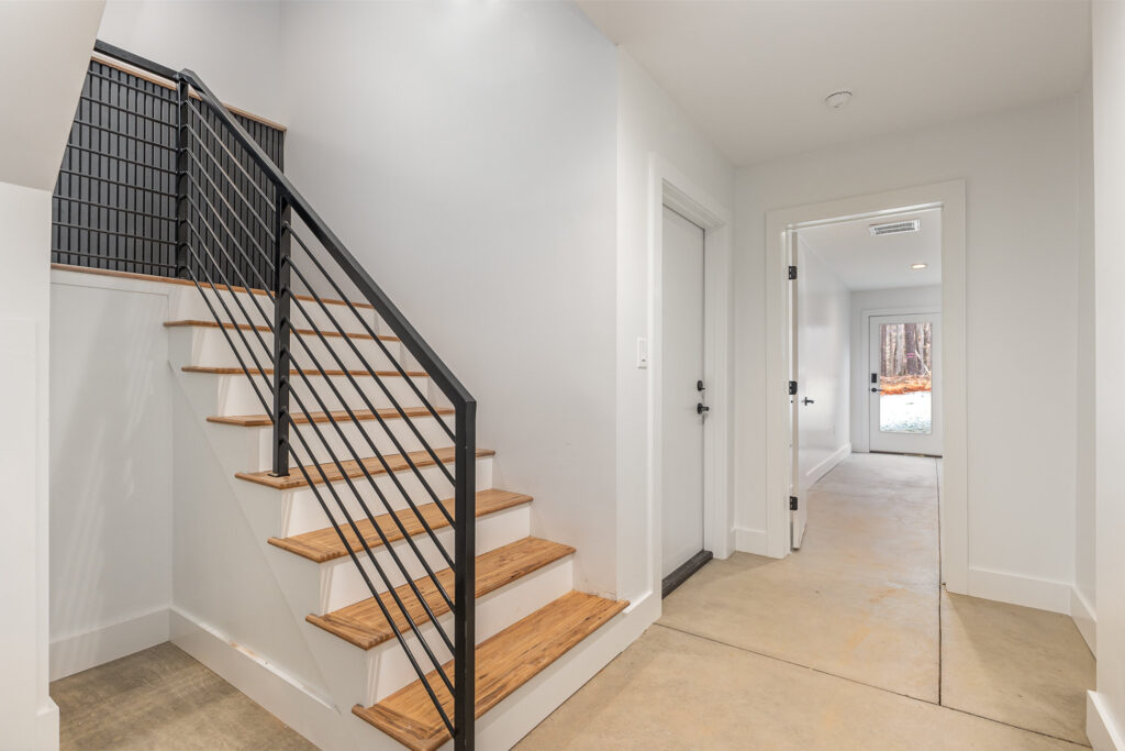 Bottom of stairs in Reynard custom home